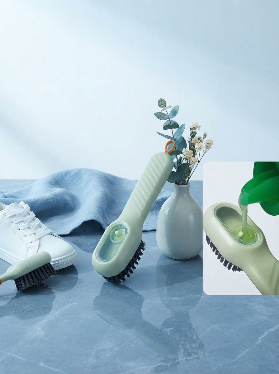 A premium multifunctional shoe polishing brush placed on a slate blue surface in a bright, modern studio environment.